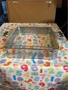 Vintage Pyrex glass dish with cradle